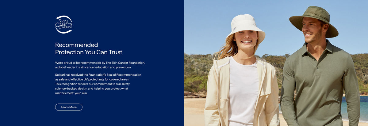Two people wearing hats with a scenic background, promoting a brand's sun protection products.