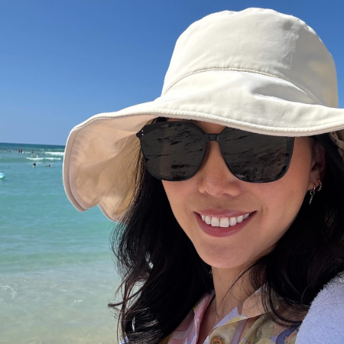 Woman in a Solbari sun hat with sunglasses
