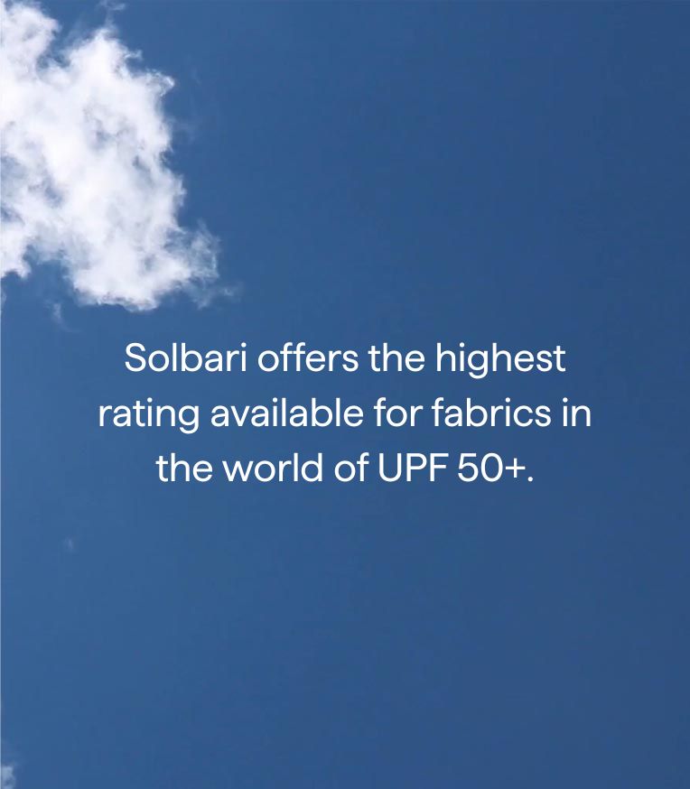 Blue sky with a white cloud and text about Solbari's fabric rating.