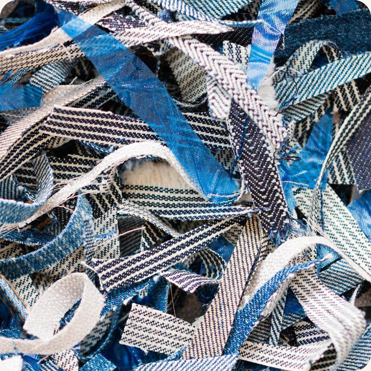 Close up of fabric scraps in strips.